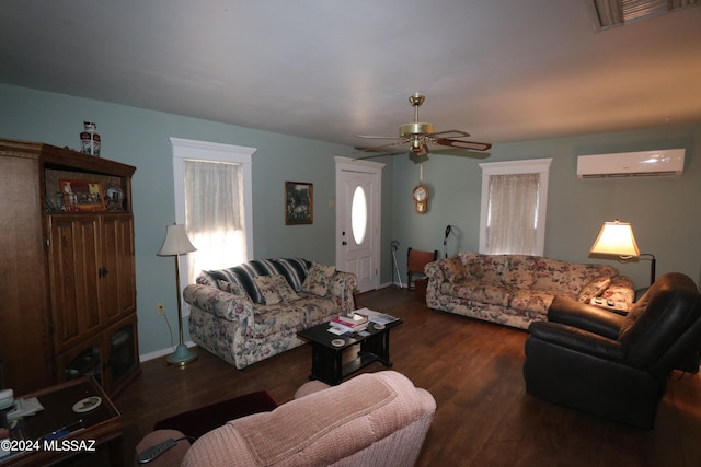 living room with ceiling fan, dark hardwood / wood-style flooring, and a wall mounted air conditioner