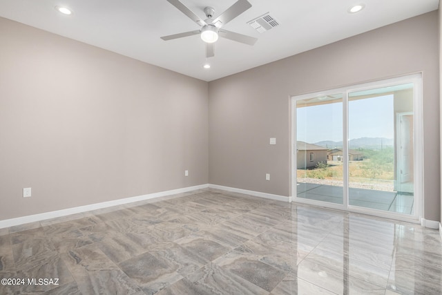 spare room featuring ceiling fan