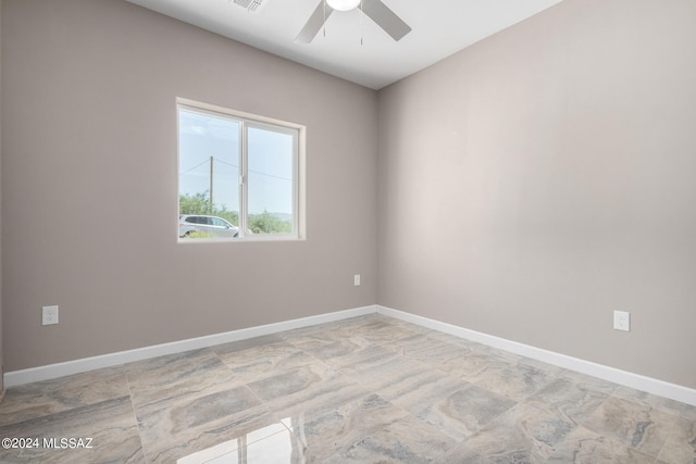 unfurnished room with ceiling fan