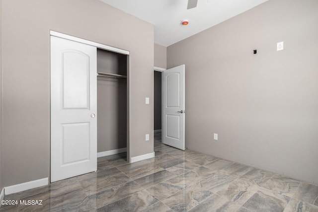 unfurnished bedroom featuring a closet and ceiling fan