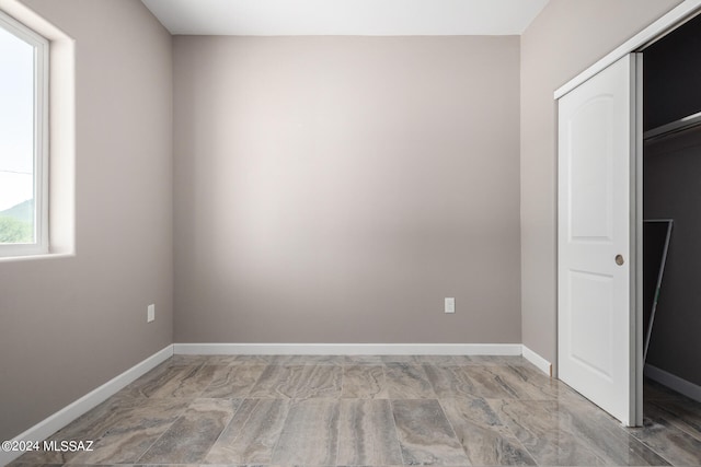 unfurnished bedroom featuring a closet