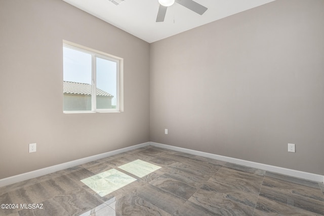 unfurnished room with ceiling fan