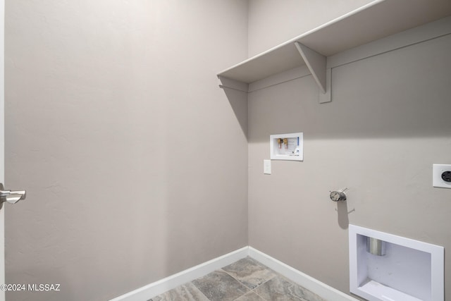 washroom with hookup for a washing machine, tile patterned floors, and electric dryer hookup