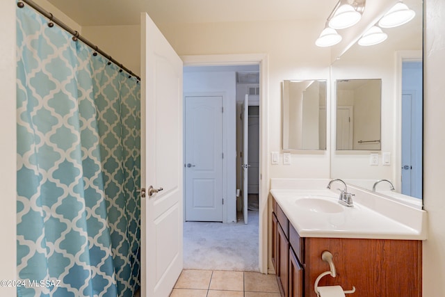 bathroom featuring tile patterned flooring and vanity