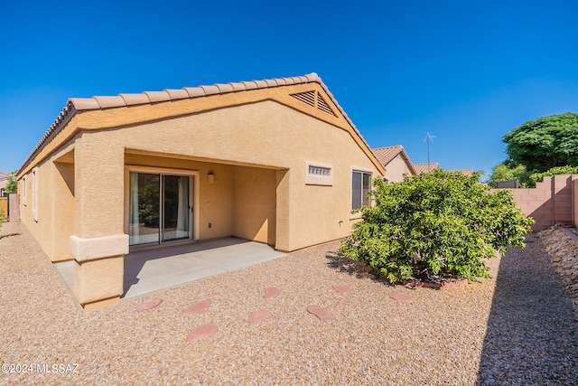 back of property featuring a patio