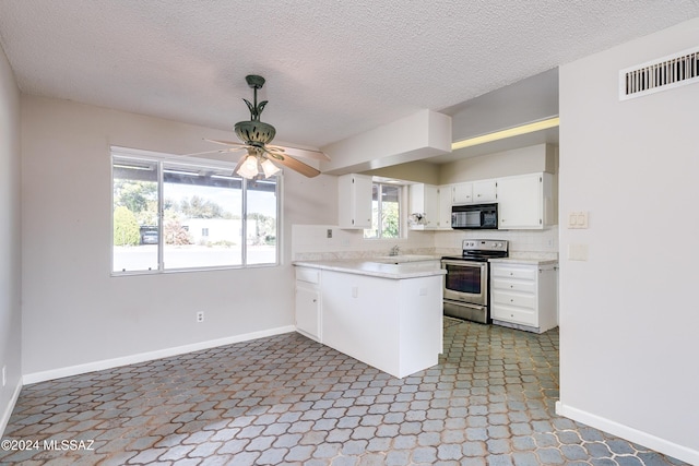 kitchen with white cabinetry, electric range, backsplash, kitchen peninsula, and a textured ceiling