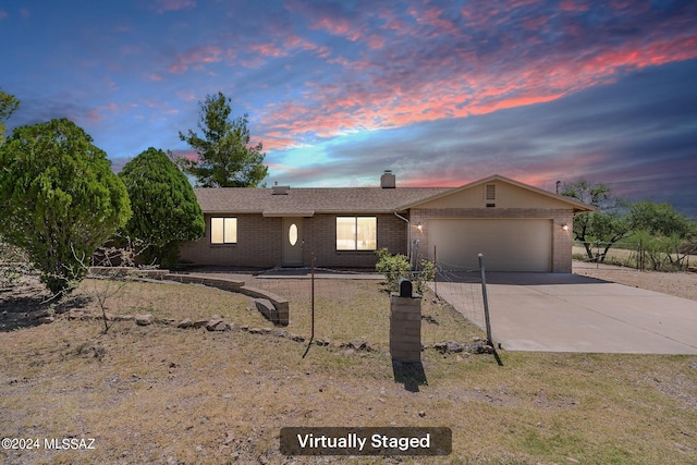 single story home with a garage