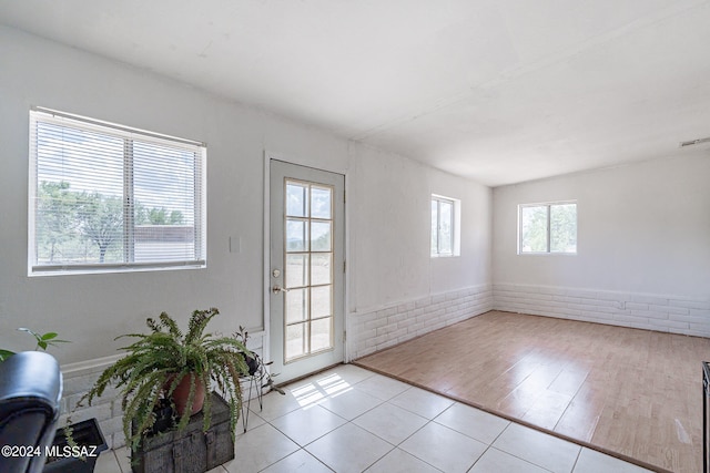 doorway to outside featuring light hardwood / wood-style flooring