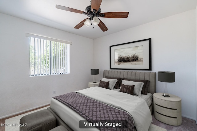 carpeted bedroom with ceiling fan