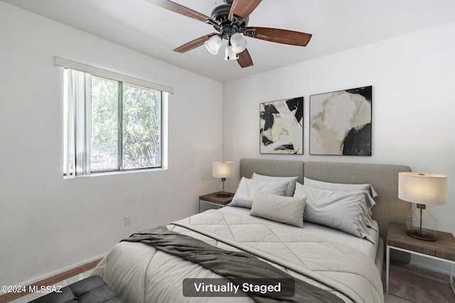 carpeted bedroom with ceiling fan