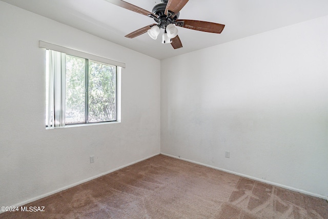 unfurnished room with ceiling fan and carpet flooring