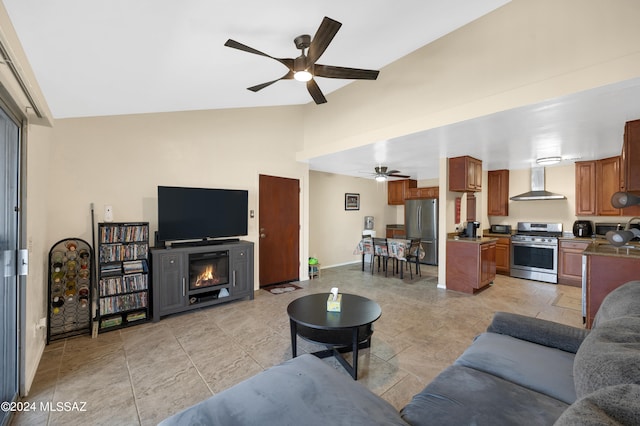 living room with lofted ceiling, ceiling fan, and sink