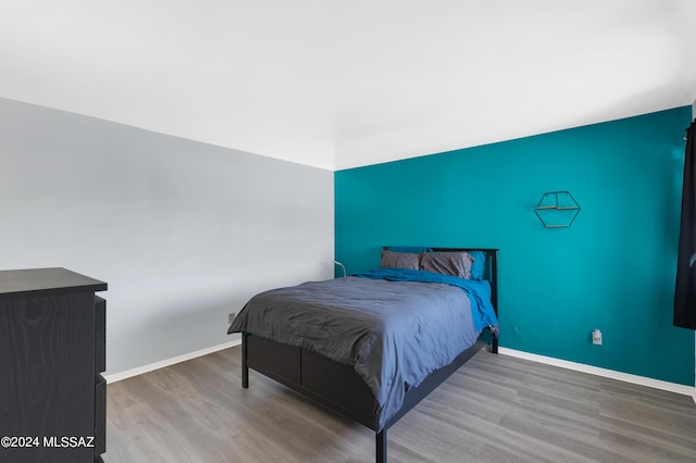 bedroom featuring hardwood / wood-style flooring