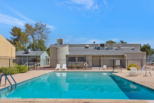 view of swimming pool with a patio area