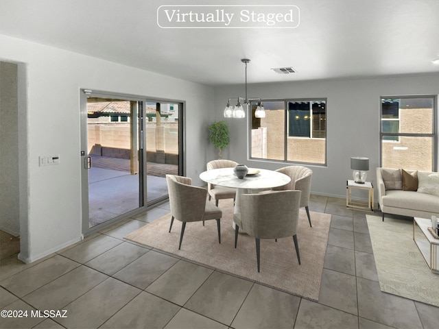 dining room featuring plenty of natural light and a chandelier