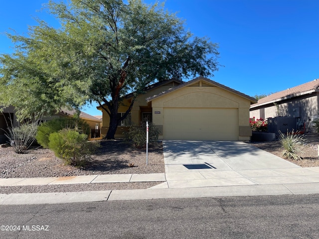 single story home featuring a garage