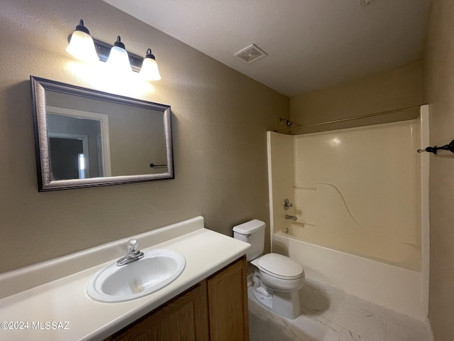 full bathroom with toilet, bathing tub / shower combination, and vanity