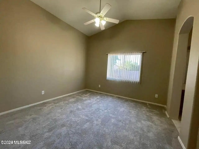 carpeted empty room with lofted ceiling and ceiling fan