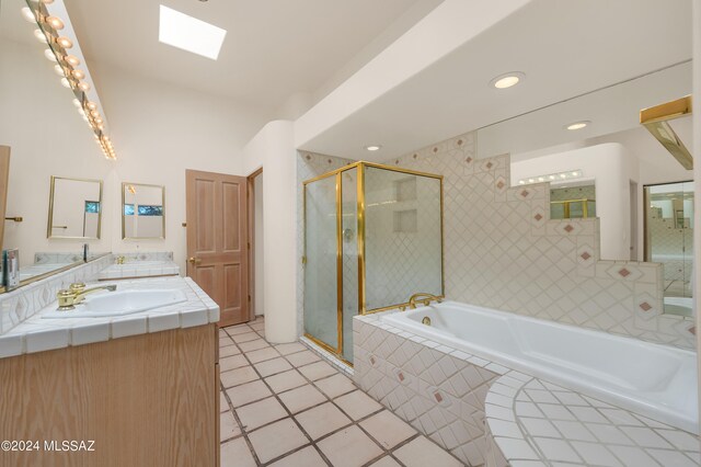 bathroom with vanity, plus walk in shower, and tile patterned flooring