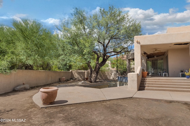 view of patio featuring ceiling fan