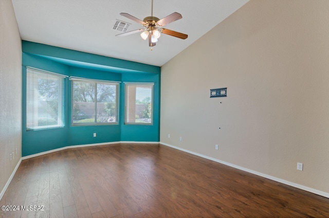 unfurnished room with visible vents, baseboards, wood finished floors, and a ceiling fan