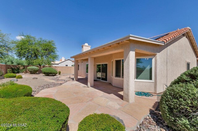 back of house with a patio area