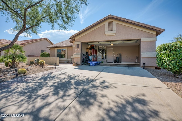 1892 E E Clf, Swallow Trail, Green Valley, AZ 85614 - ranch-style house with an attached garage, stucco siding, a tile roof, and concrete driveway