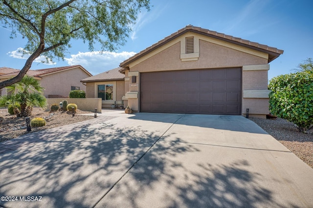 1892 E E Clf, Swallow Trail, Green Valley, AZ 85614 - single story home with an attached garage, stucco siding, a tile roof, and concrete driveway