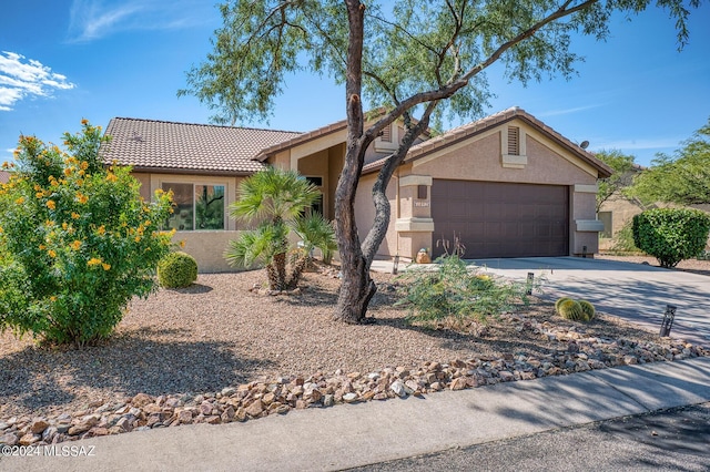 1892 E E Clf, Swallow Trail, Green Valley, AZ 85614 - single story home with concrete driveway, a tiled roof, an attached garage, and stucco siding