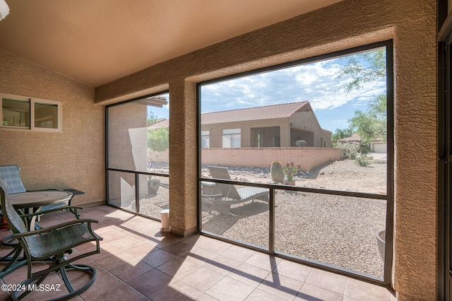 sunroom with vaulted ceiling