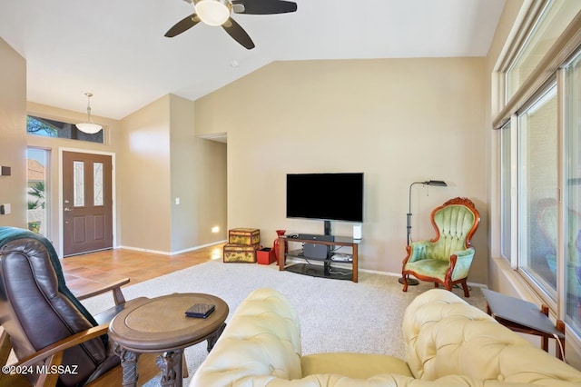 living room with lofted ceiling, light wood-type flooring, and ceiling fan