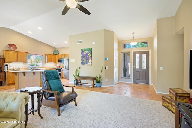 1892 E E Clf, Swallow Trail, Green Valley, AZ 85614 - foyer with high vaulted ceiling, a ceiling fan, baseboards, light tile patterned floors, and visible vents