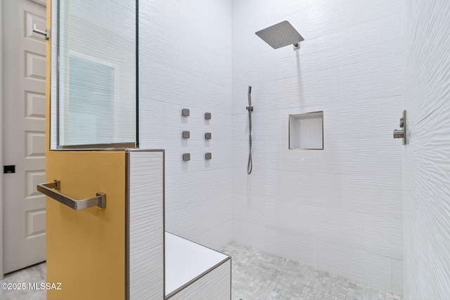 bathroom featuring tiled shower