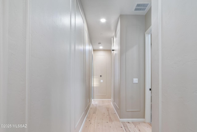 hallway featuring light hardwood / wood-style flooring