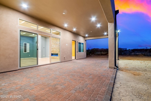 view of patio terrace at dusk