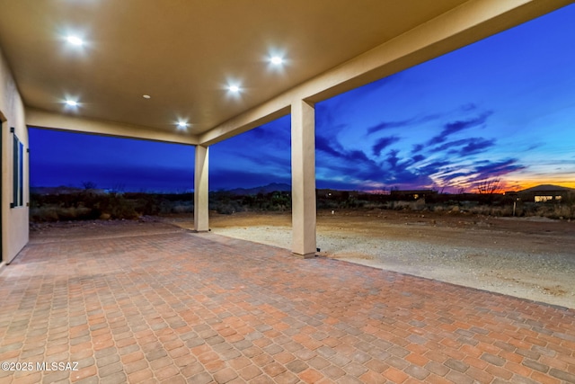 view of patio terrace at dusk