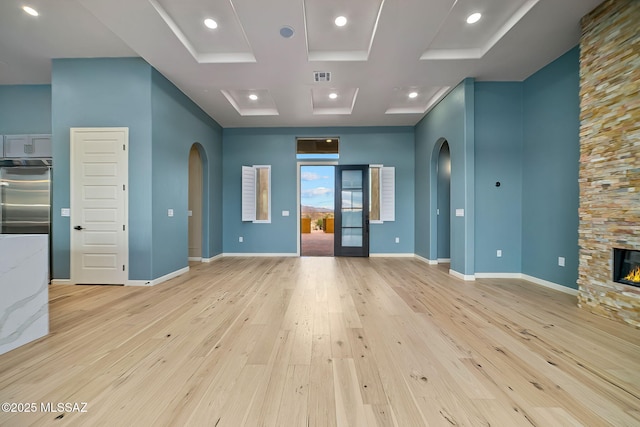 interior space featuring a fireplace and light hardwood / wood-style floors