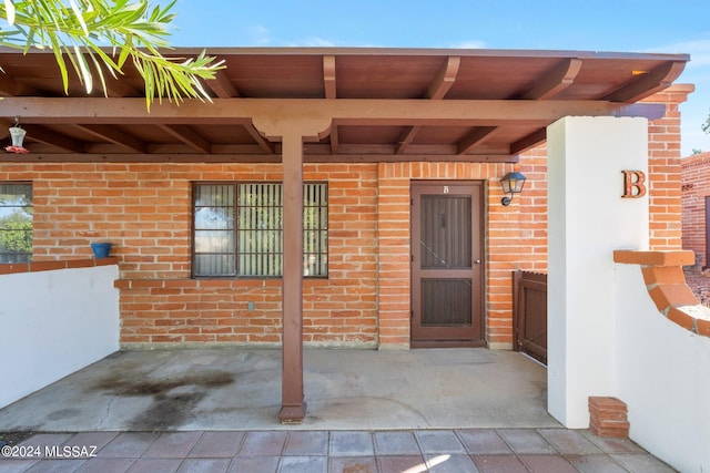 doorway to property featuring a patio