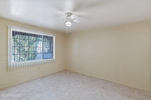 empty room featuring ceiling fan