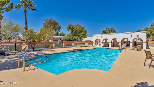 view of swimming pool with a patio