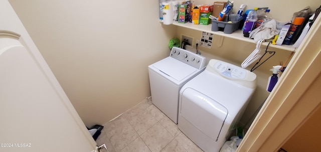 laundry room with separate washer and dryer