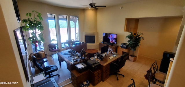 tiled office space with ceiling fan and french doors