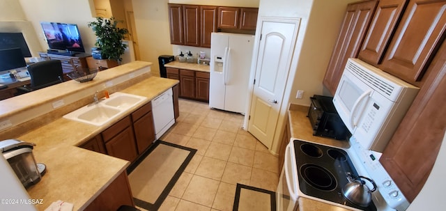 kitchen featuring white appliances, light tile patterned flooring, and sink