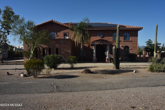 view of front of house featuring solar panels