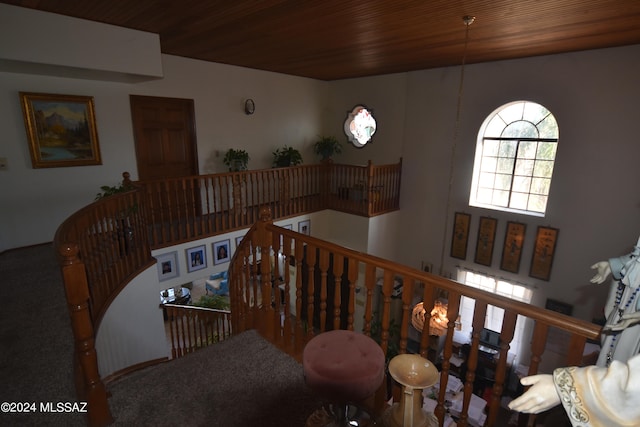 staircase featuring wooden ceiling