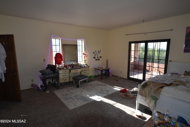 bedroom featuring multiple windows and carpet floors