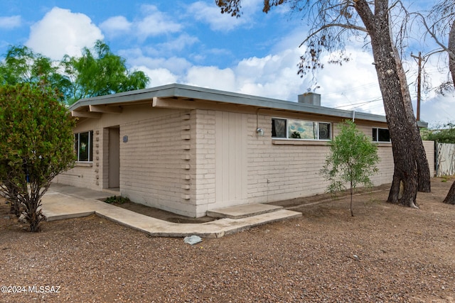 view of side of home featuring a patio