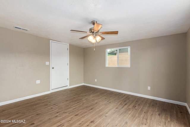 unfurnished room featuring hardwood / wood-style flooring and ceiling fan