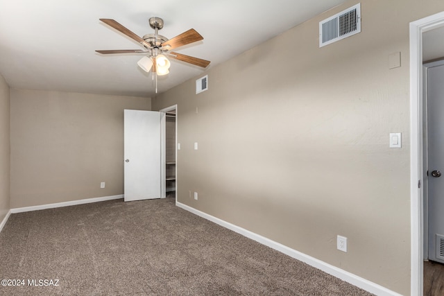 unfurnished bedroom featuring carpet and ceiling fan