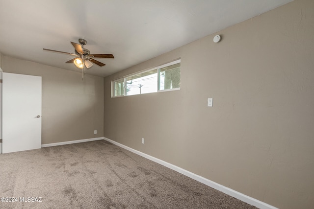 carpeted empty room with ceiling fan